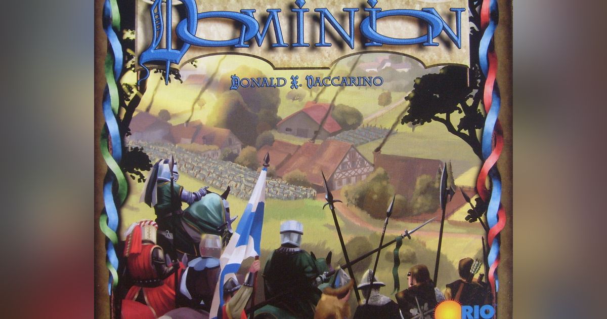 Box art for Dominion showing a medieval crown and castle over a deck of gameplay cards